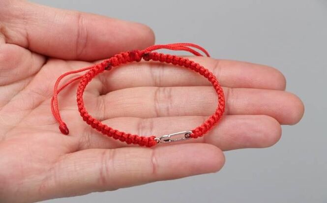 Red thread that protects from evil (in the left wrist) and attracts happiness (in the right wrist)